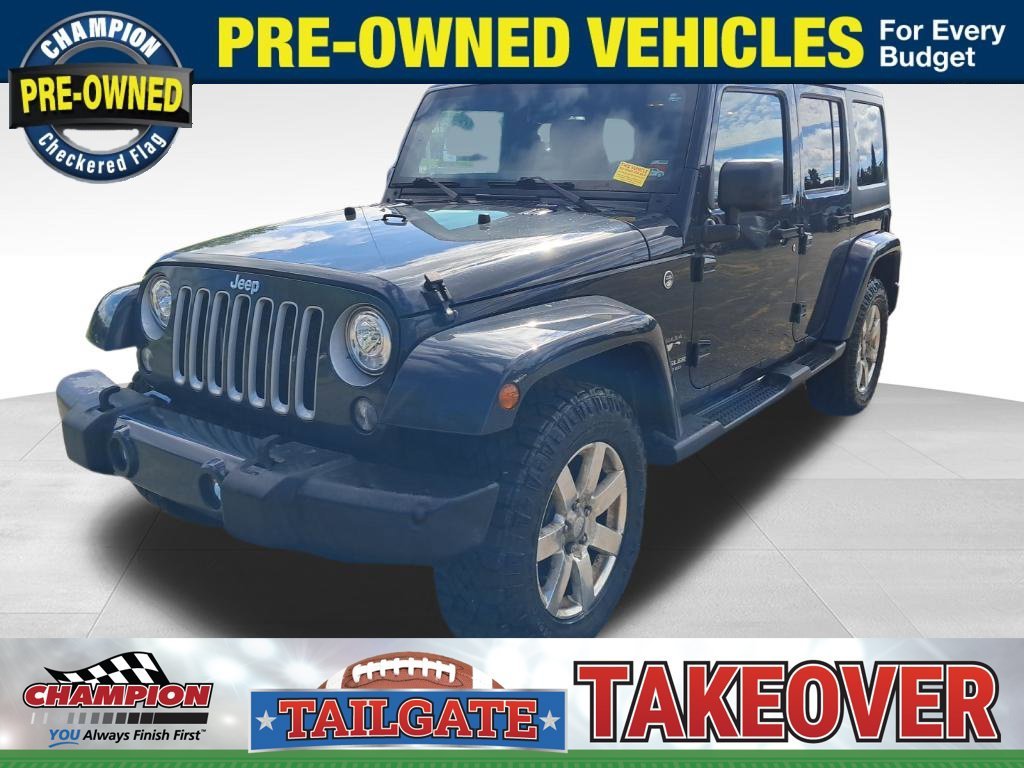 Used 2017 Black Jeep Unlimited Sahara image 1