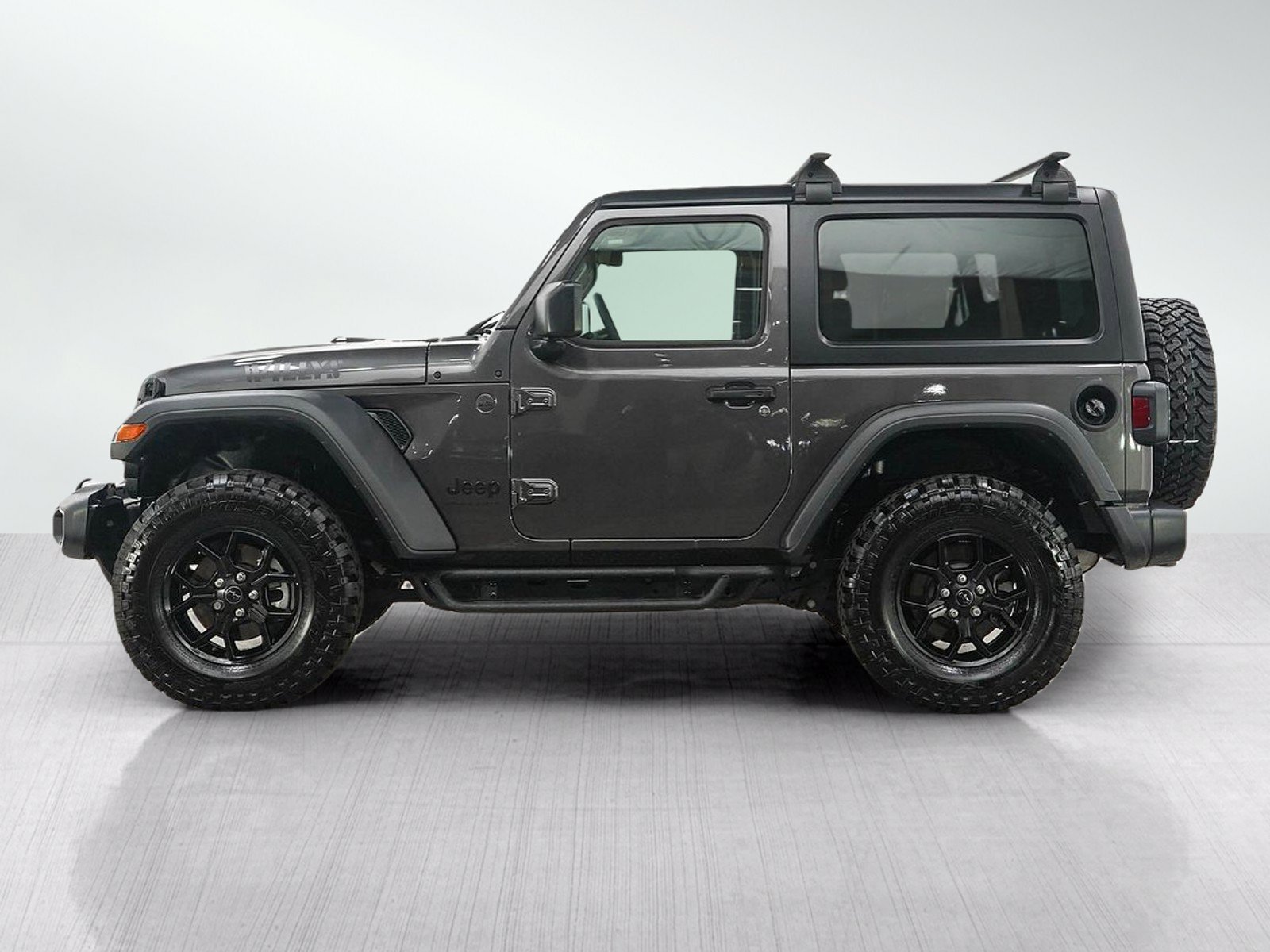 Used 2025 Jeep Wrangler 2-Door Willys with VIN 1C4PJXAN6SW563990 for sale in Minneapolis, Minnesota
