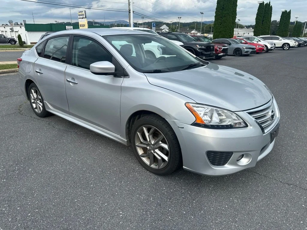 Used 2013 Brilliant Silver Nissan SR image 1