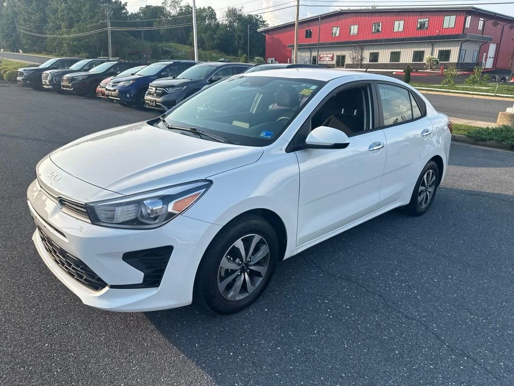 Used 2023 Clear White Kia S image 1