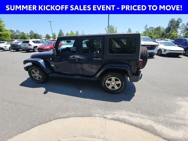 Used 2013 Blue Jeep Unlimited Sport image 9