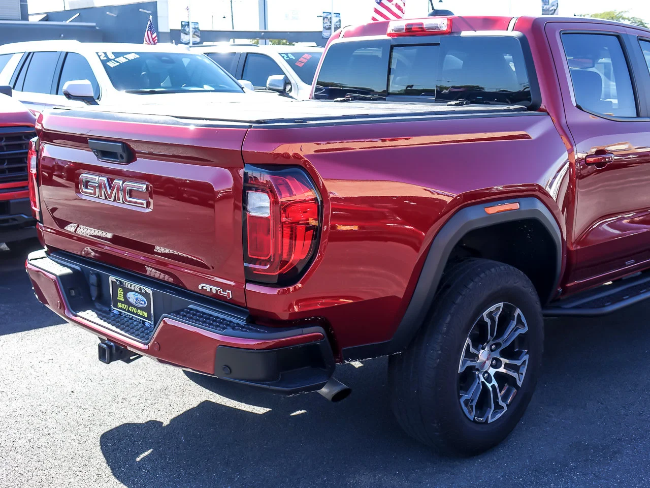 Used 2024 Volcanic Red Tintcoat GMC 4WD AT4 image 6