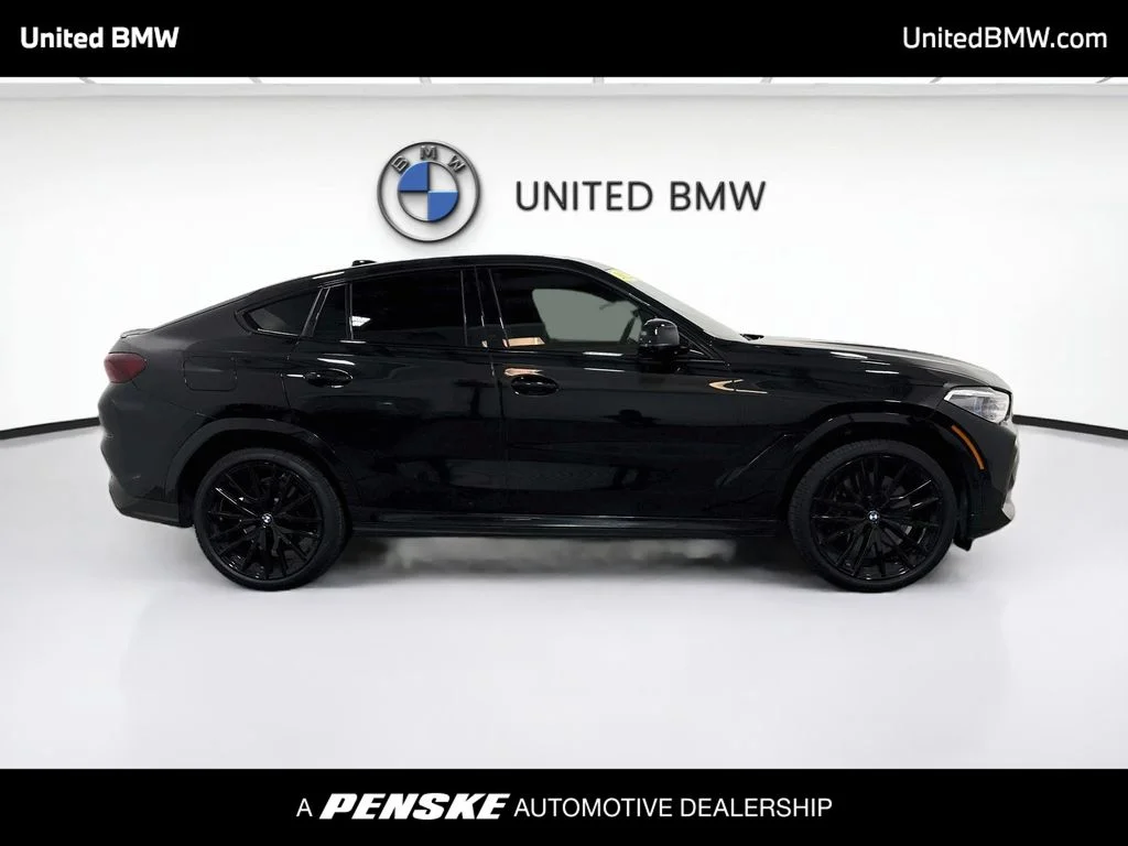 Used 2022 Black Sapphire Metallic BMW M50i image 4