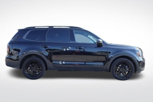 Used 2025 Ebony Black Kia EX X-Line image 13