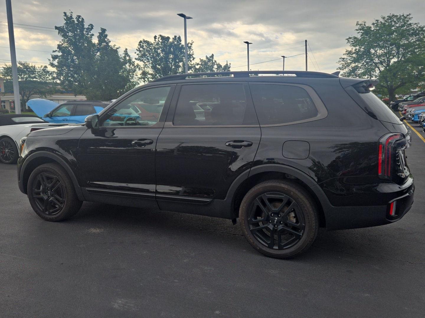 Used 2024 Ebony Black Kia EX X-Line image 4