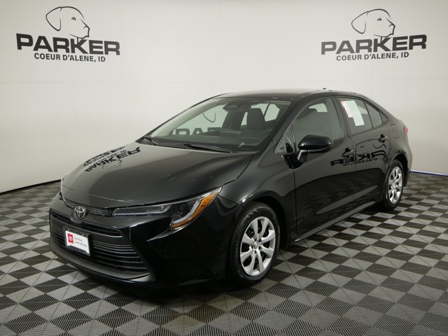 Used 2025 Midnight Black Metallic Toyota LE image 1