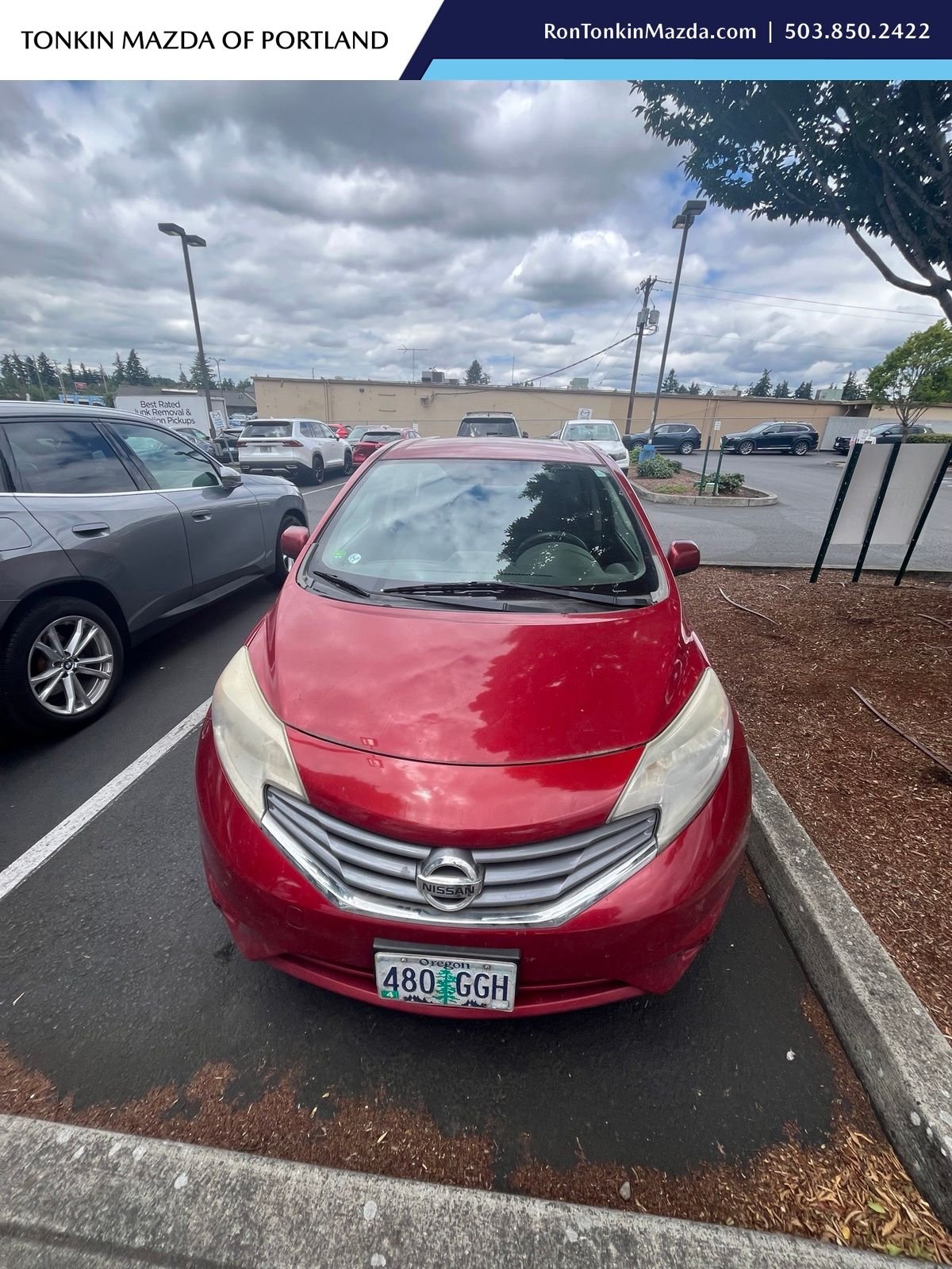 Used 2014 Red Brick Metallic Nissan S image 1