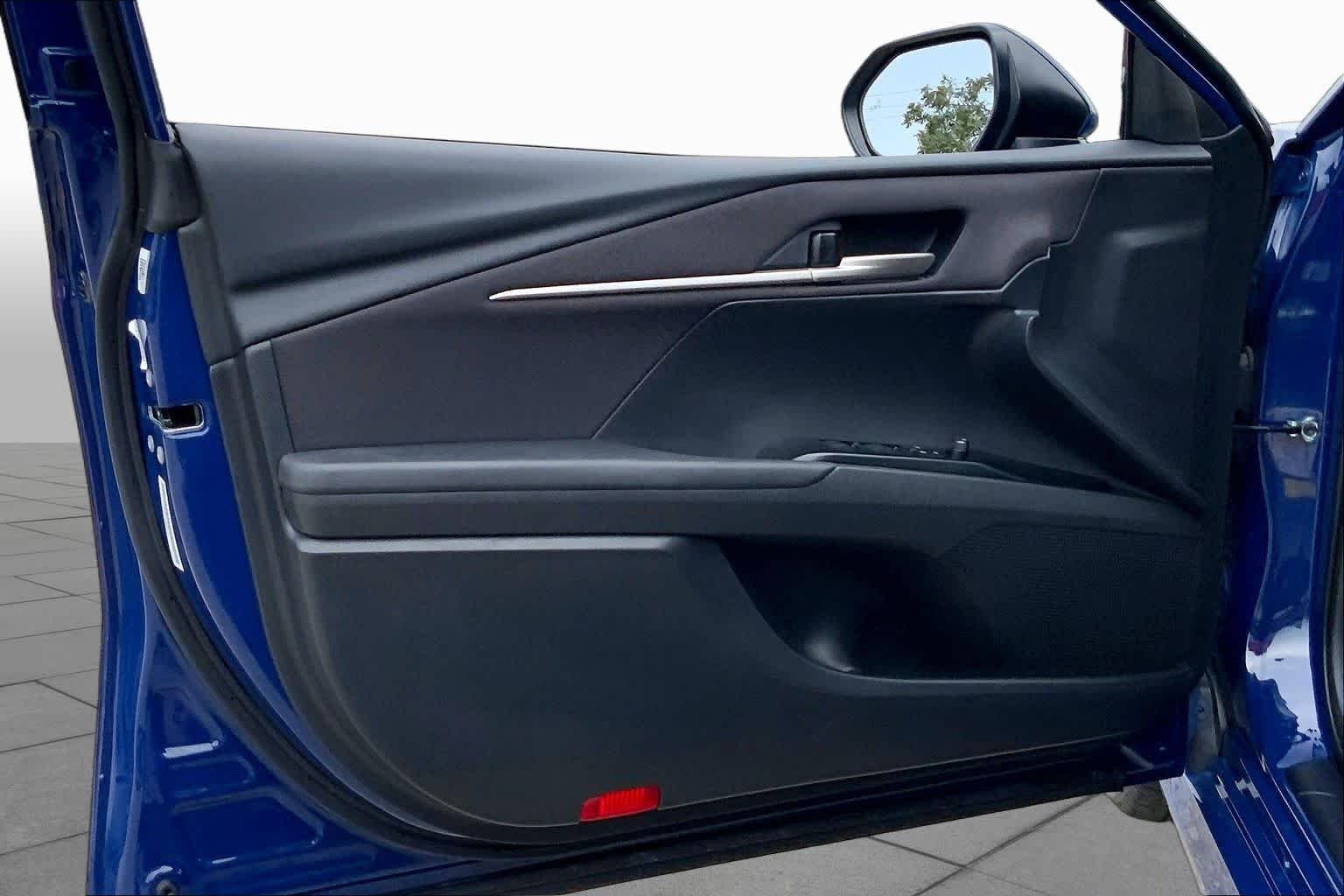 Used 2025 Reservoir Blue Toyota LE image 21