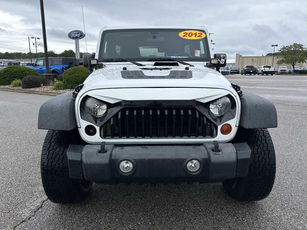 Used 2012 Bright White Jeep Unlimited Sport image 9