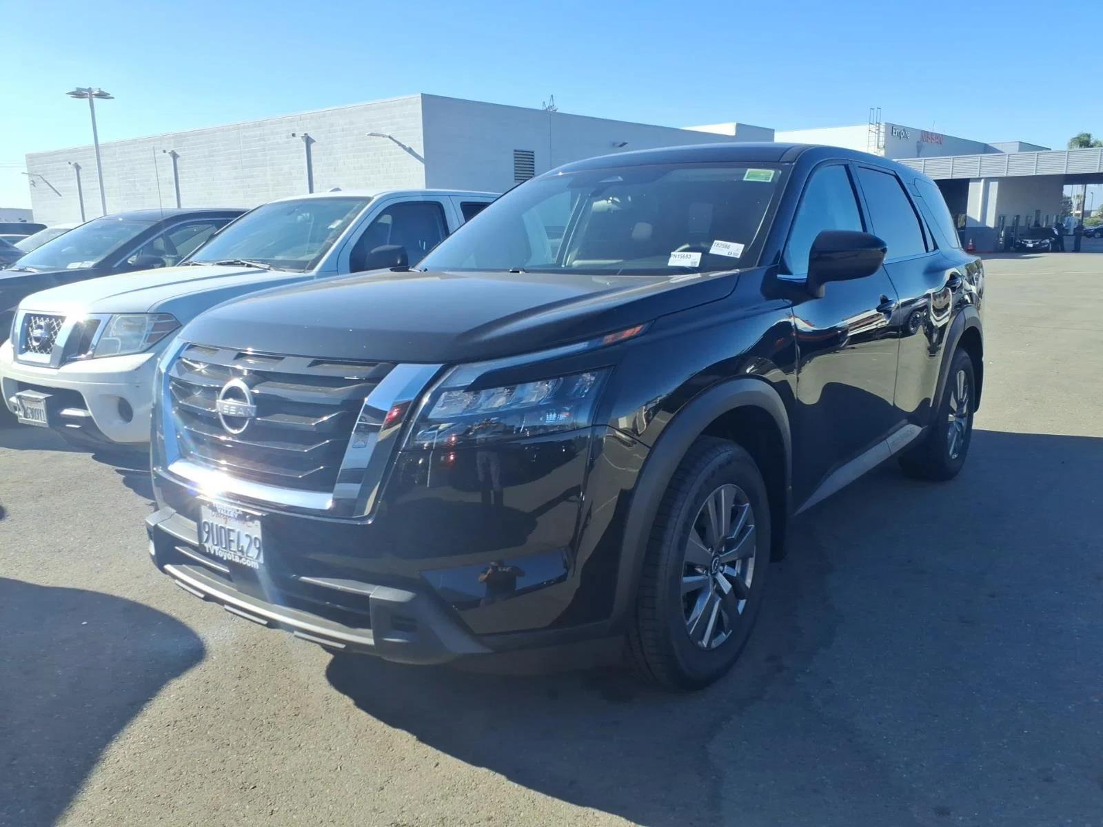 Certified Used 2025 Super Black Nissan S image 1