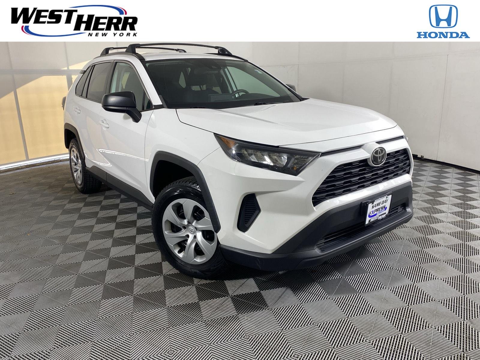 Used 2021 Super White Toyota LE image 1