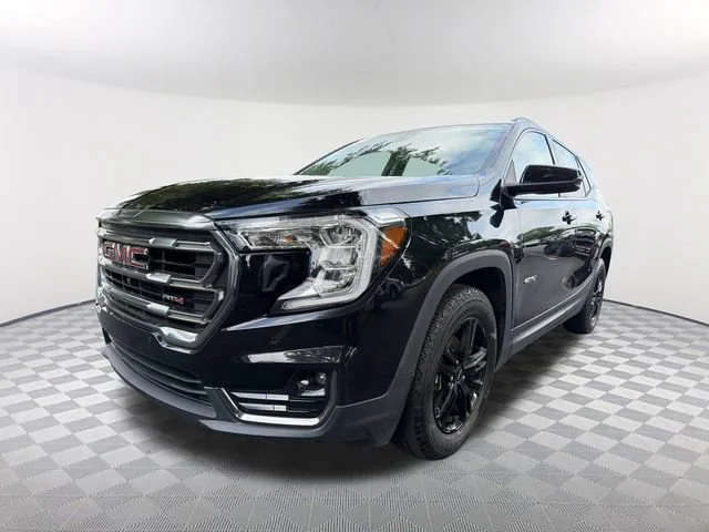 Used 2023 Ebony Twilight Metallic GMC AT4 image 1