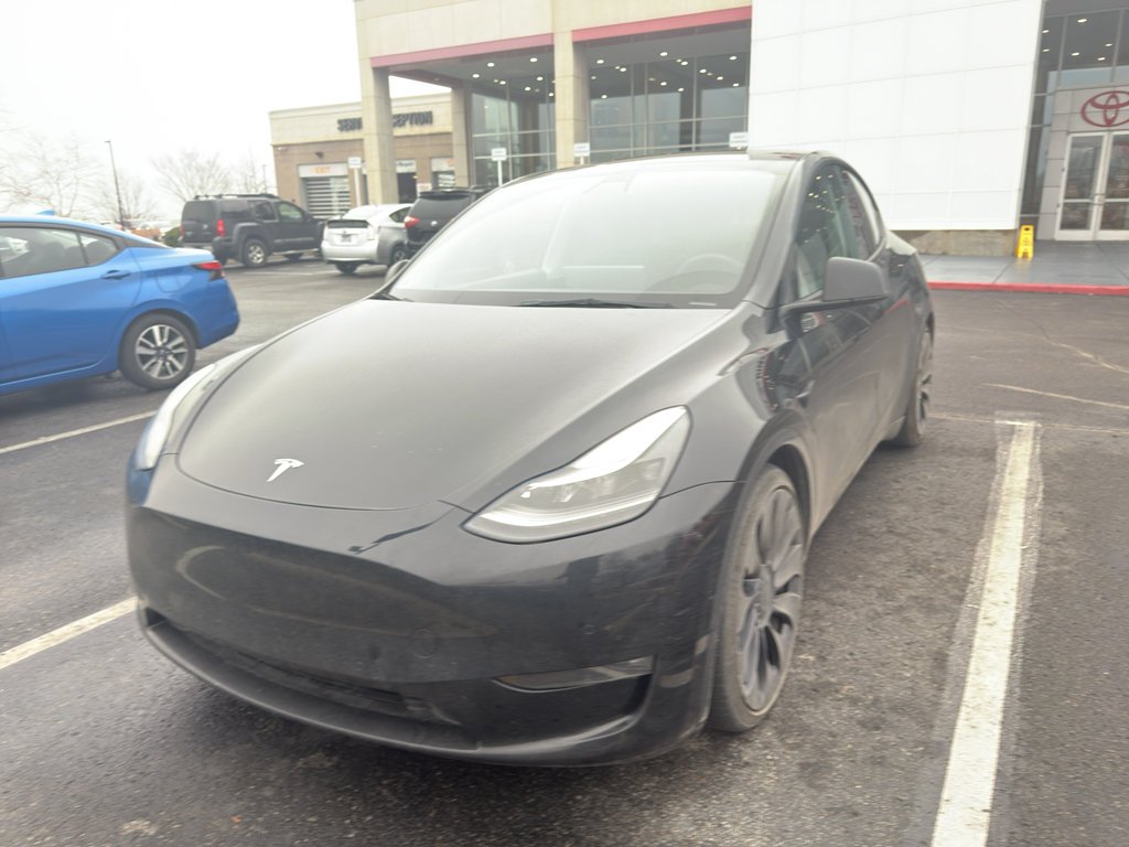 Used 2022 Solid Black Tesla Performance image 1