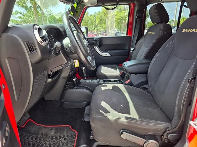 Used 2015 Red Jeep Unlimited Sahara image 13