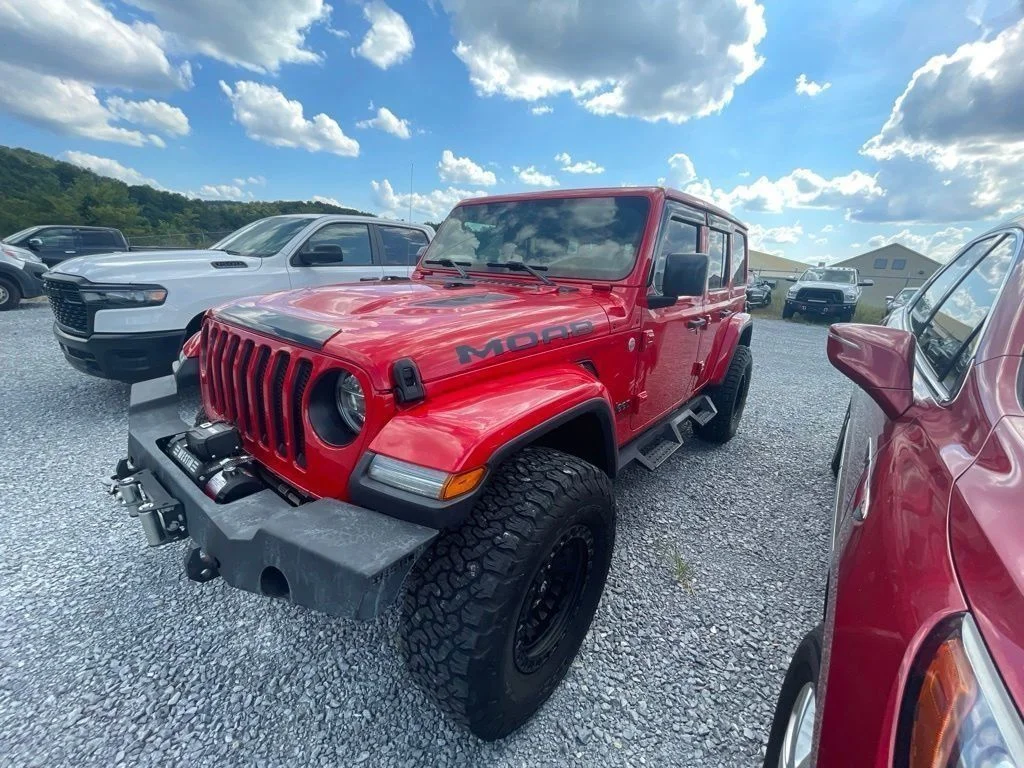 Used 2018 Red Jeep Unlimited Sahara image 1