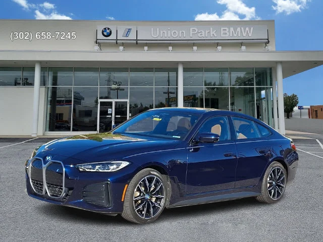 Certified Used 2022 Tanzanite Blue II Metallic BMW eDrive40 image 1