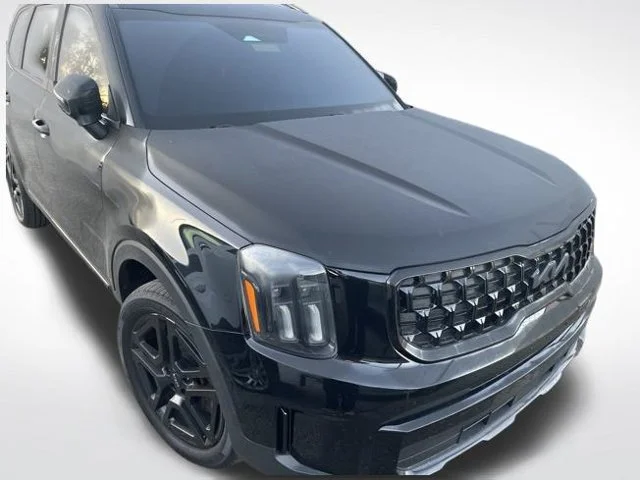 Used 2024 Black Kia EX X-Line image 1