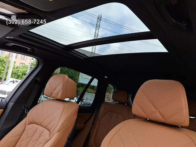 Certified Used 2025 Mineral White Metallic BMW xDrive50e image 13