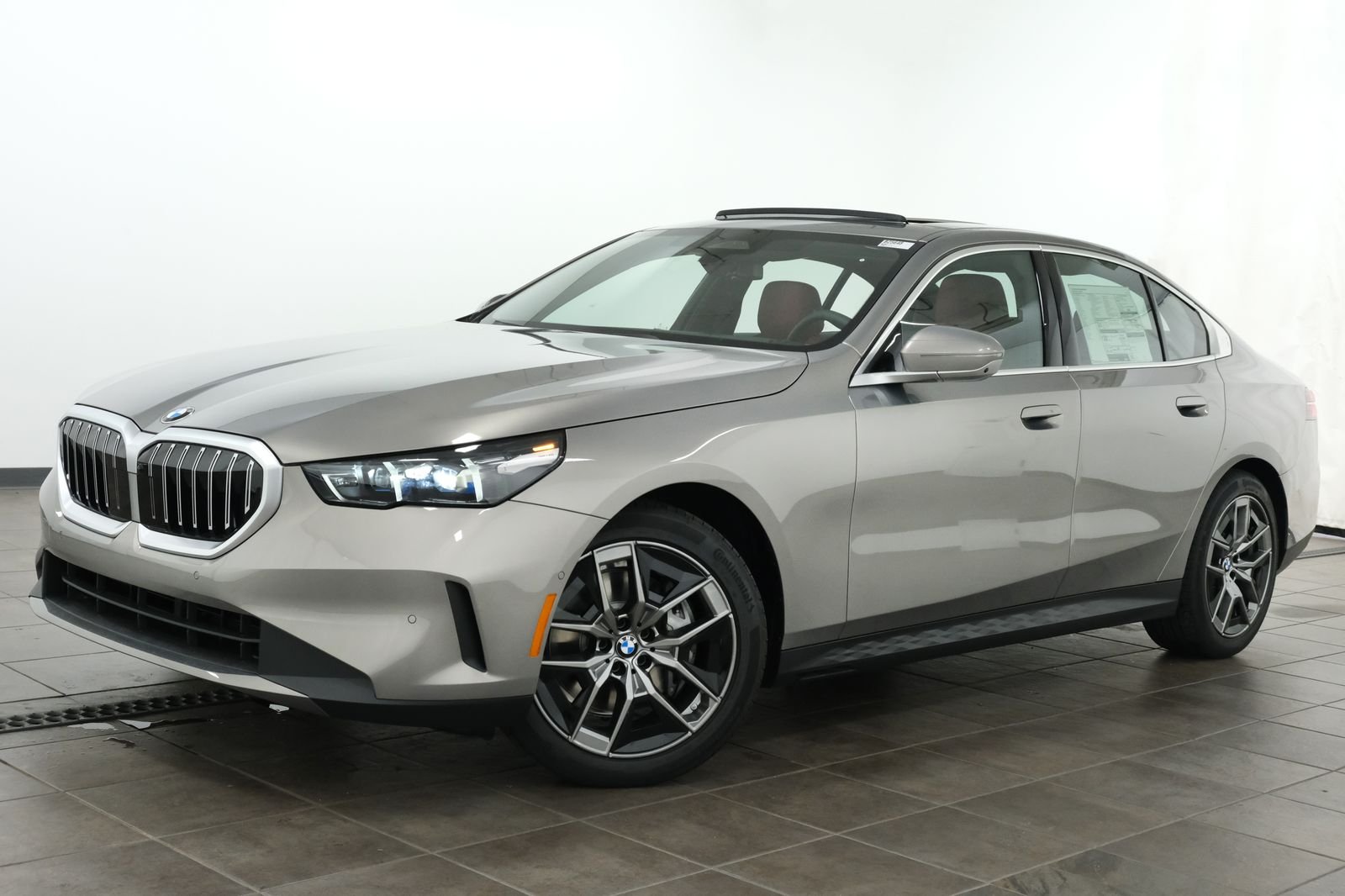 New 2027 Oxide Grey Metallic BMW 540i xDrive image 1