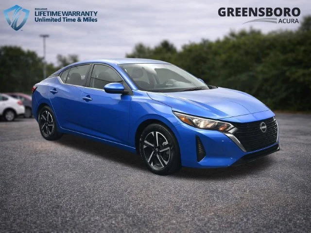 Used 2024 Electric Blue Metallic Nissan SV image 1