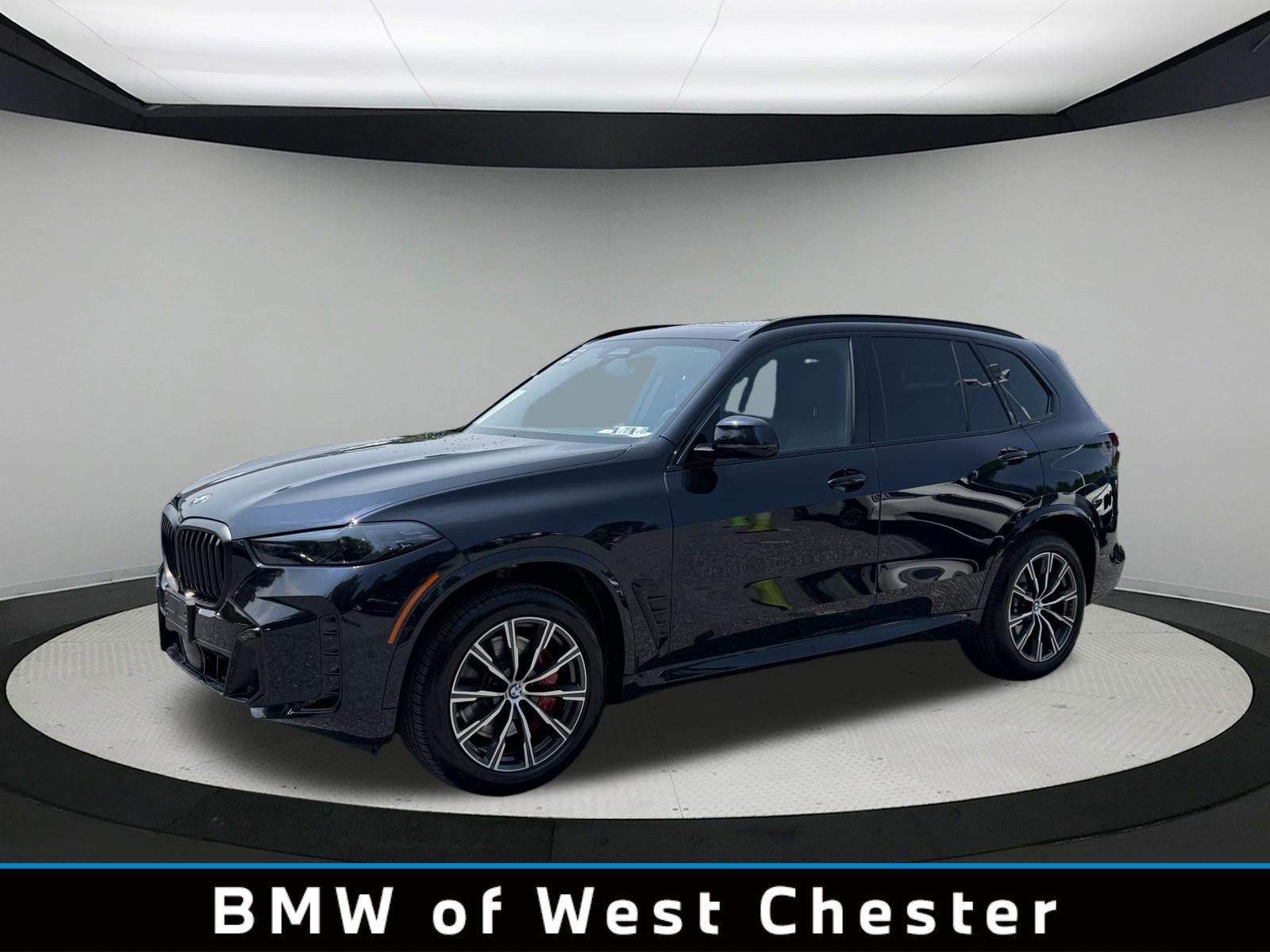 Certified Used 2026 Carbon Black Metallic BMW xDrive40i image 1