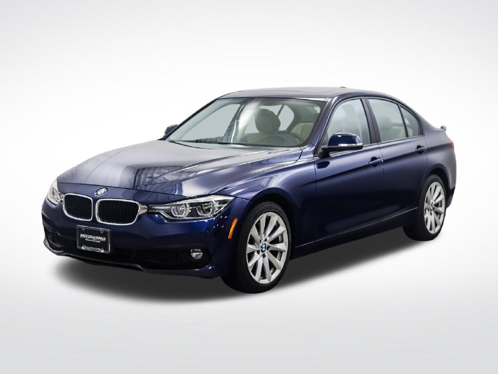Used 2018 Blue Metallic BMW 320i xDrive image 1