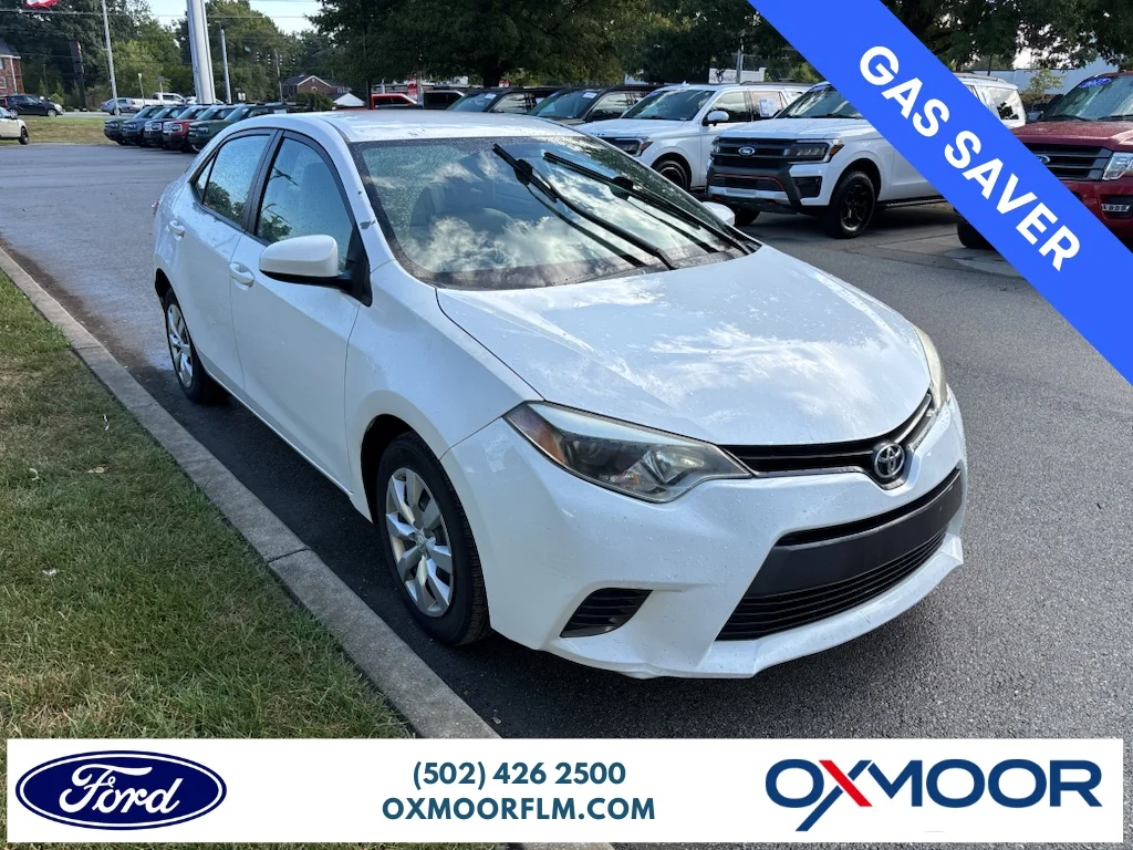 Used 2016 Super White Toyota LE image 1