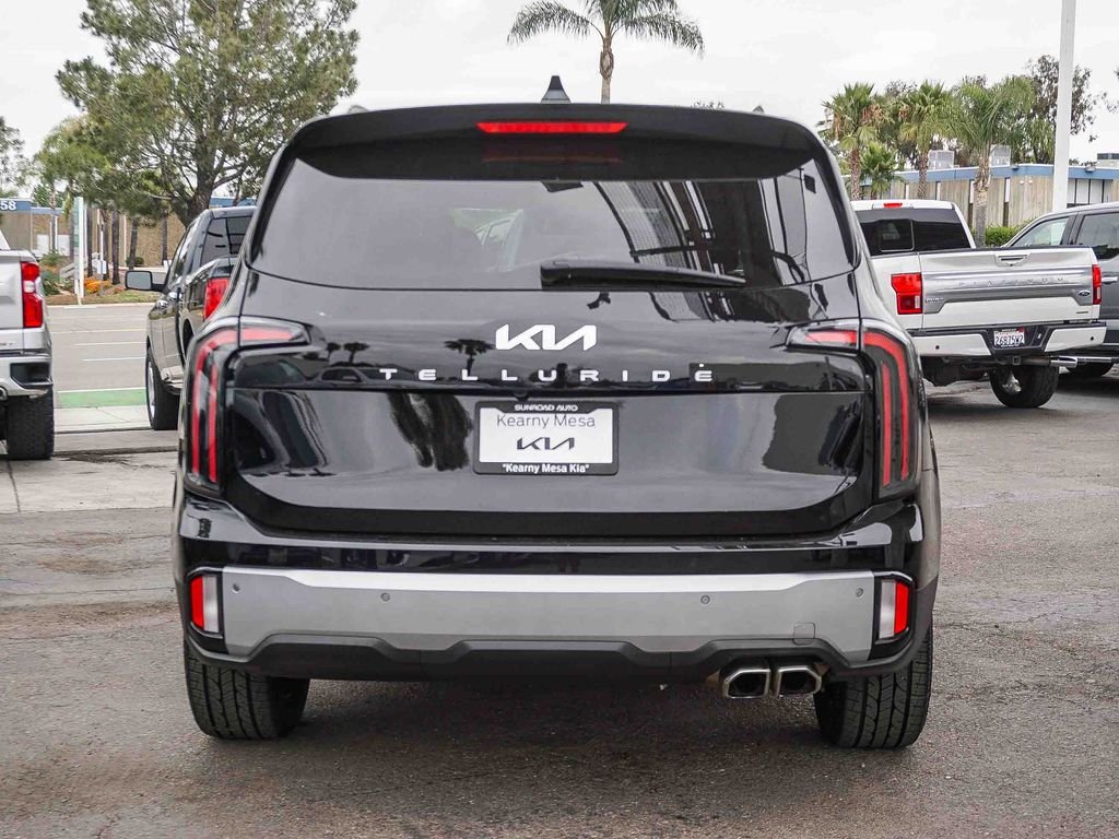 Used 2024 Ebony Black Kia EX image 6