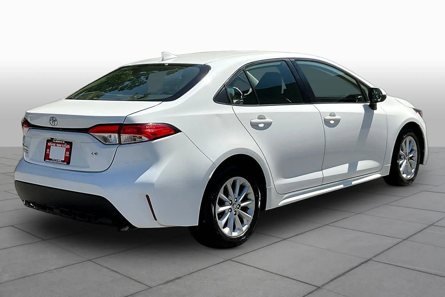 Used 2021 Super White Toyota LE image 13