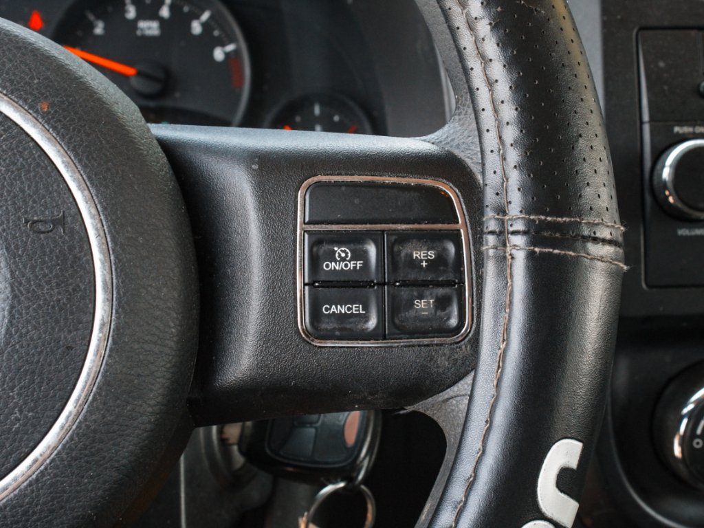 Used 2012 Bright Silver Metallic Clearcoat Jeep Sport image 11