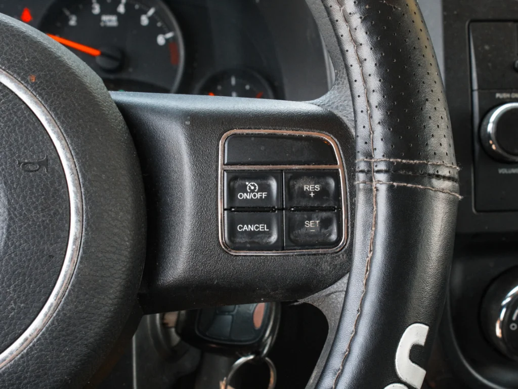Used 2012 Bright Silver Metallic Clearcoat Jeep Sport image 11