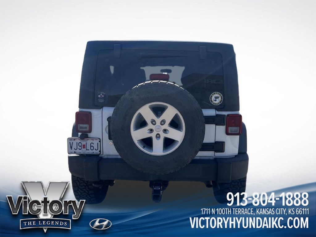 Used 2013 White Jeep Unlimited Sport image 4