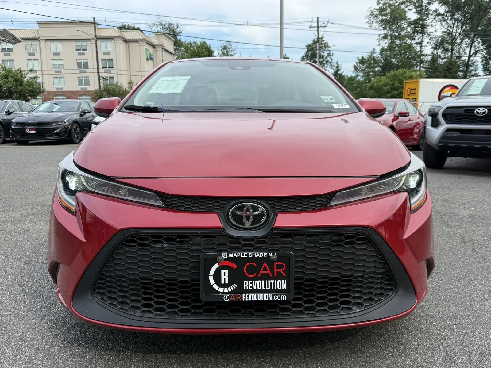 Used 2021 Barcelona Red Metallic Toyota LE image 2
