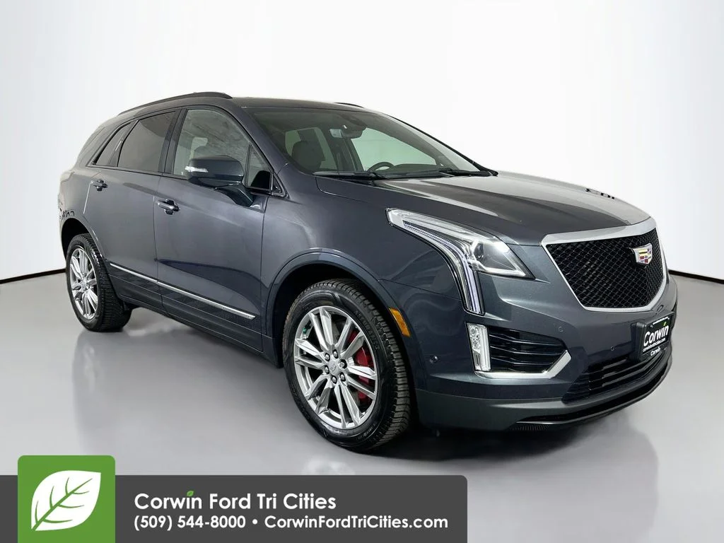Used 2023 Stellar Black Metallic Cadillac Sport image 1