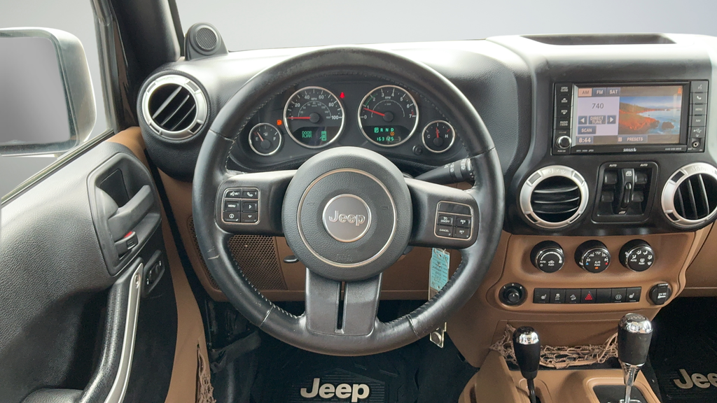 Used 2012 Black Clearcoat Jeep Unlimited Sahara image 9