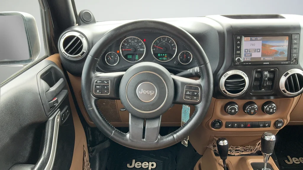 Used 2012 Black Jeep Unlimited Sahara image 9