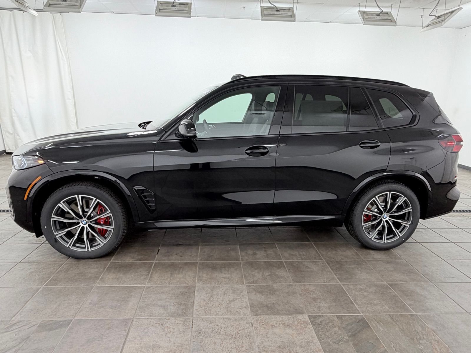New 2026 Black Sapphire Metallic BMW M60i image 2