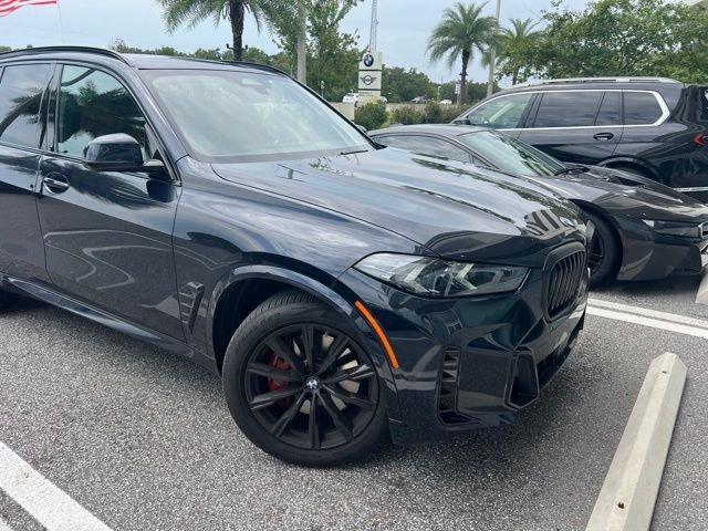 Certified Used 2025 Carbon Black Metallic BMW xDrive40i image 1