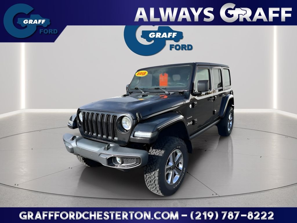 Used 2018 Black Jeep Unlimited Sahara image 1