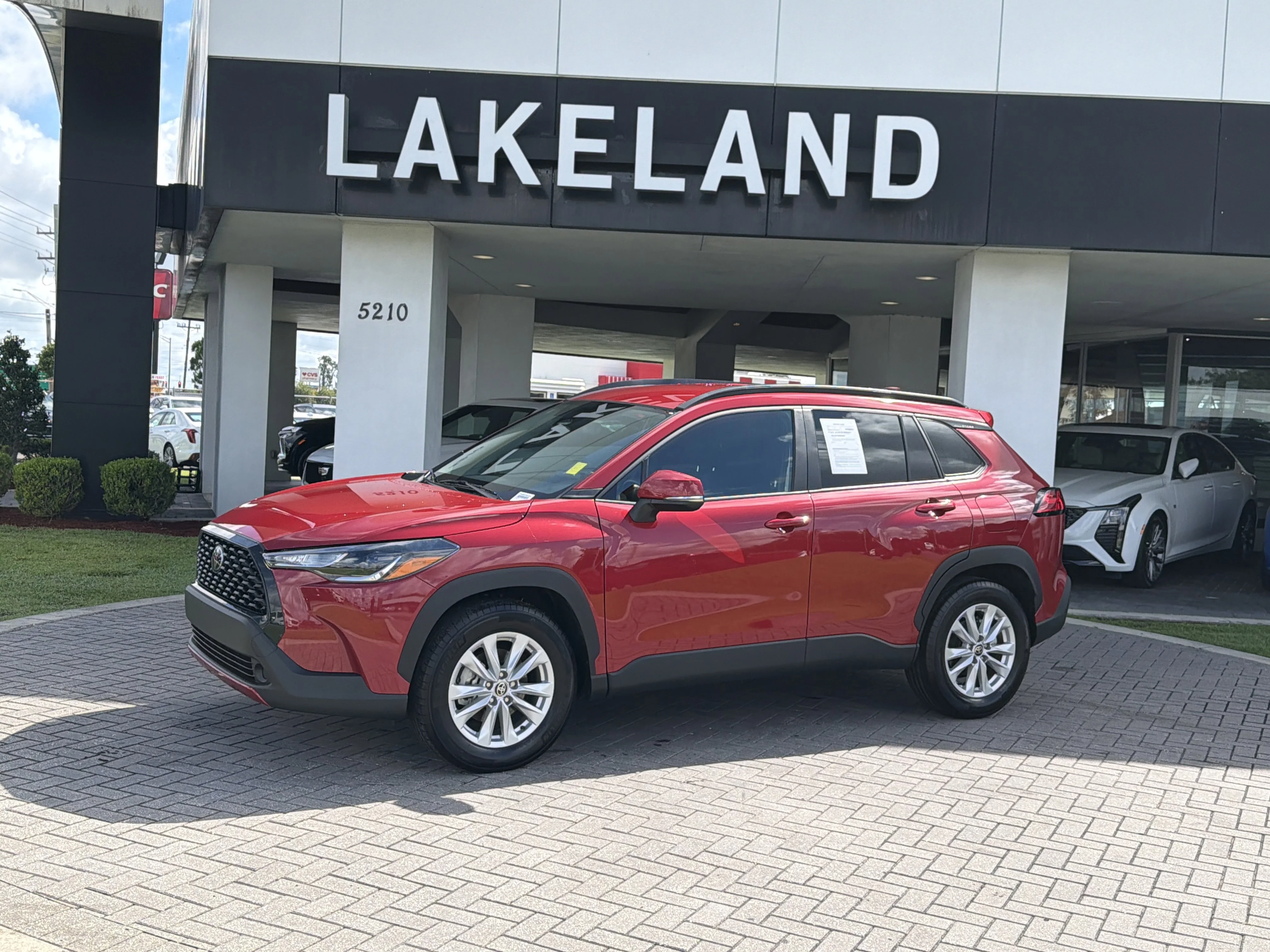 Used 2023 Barcelona Red Metallic Toyota LE image 2