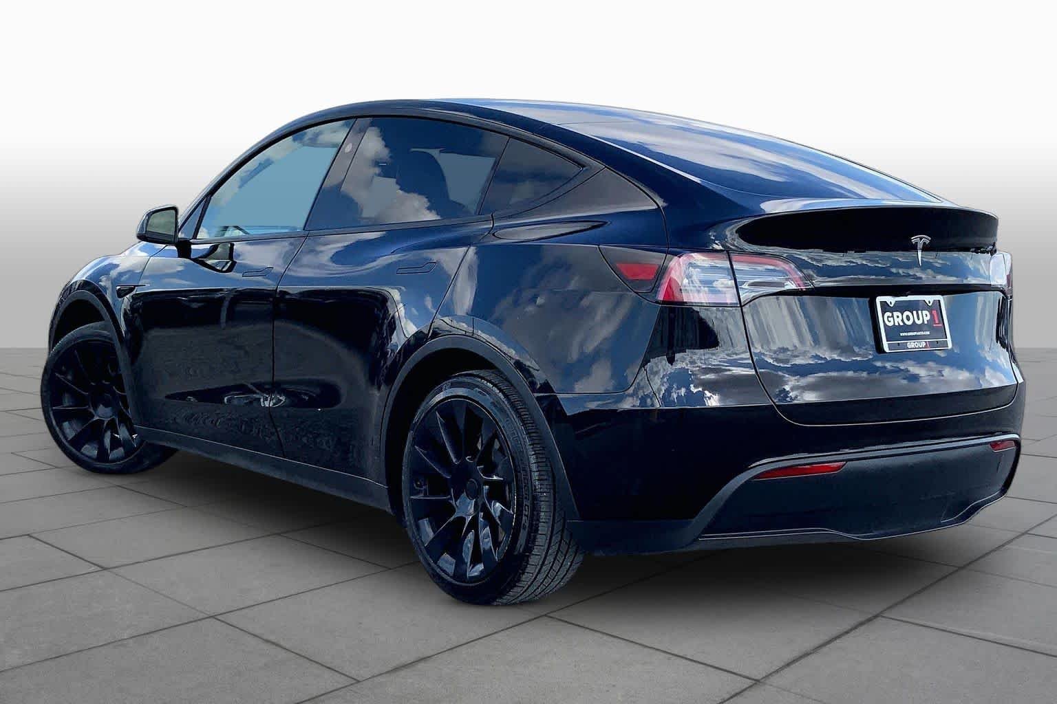 Used 2024 Solid Black Tesla  image 11