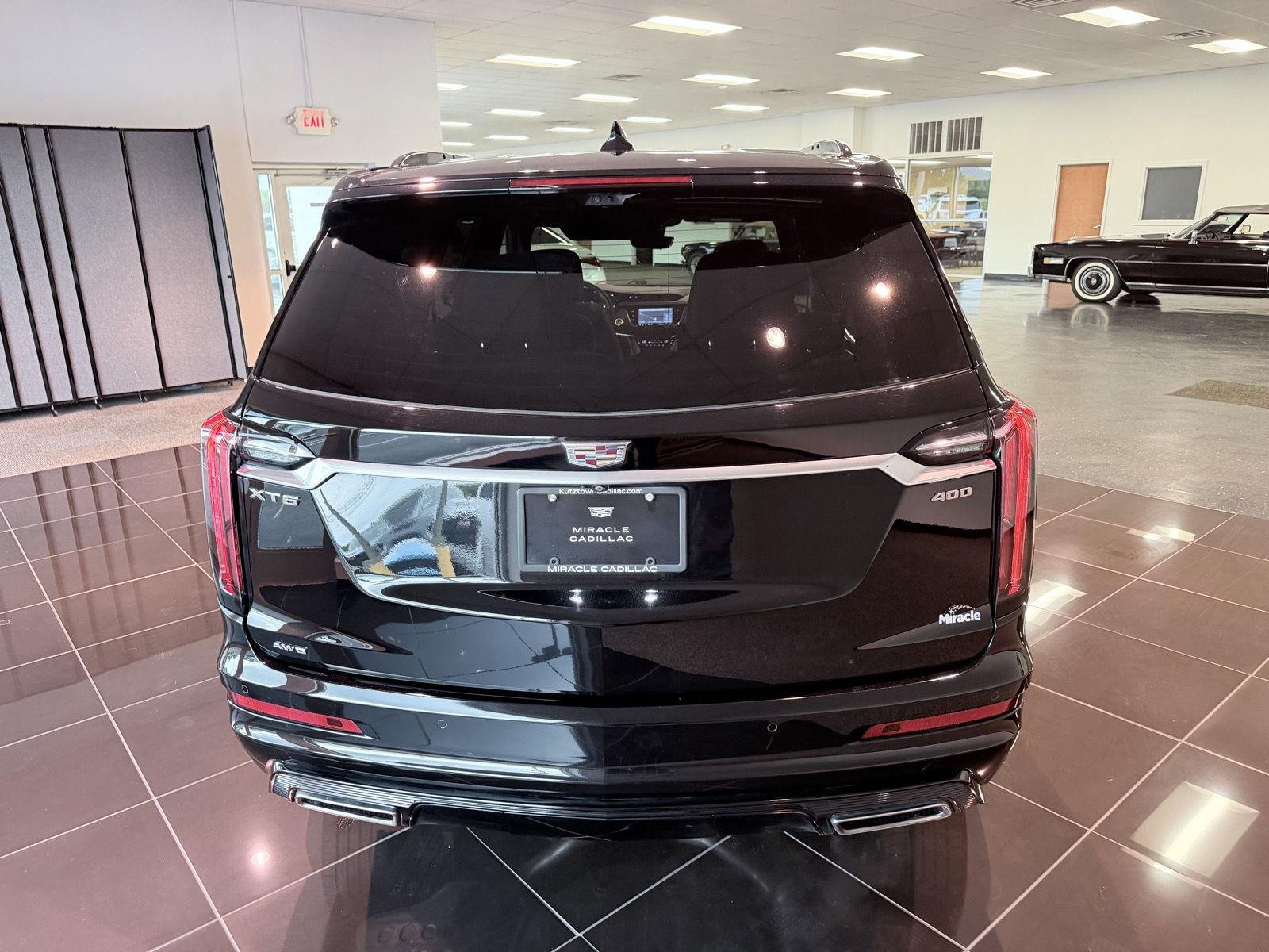 Used 2024 Stellar Black Metallic Cadillac Sport image 14