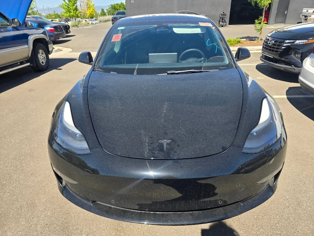 Used 2022 Solid Black Tesla Performance image 8