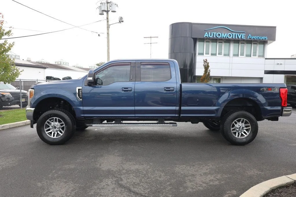 Used 2019 Blue Jeans Metallic Ford LARIAT 4WD Crew Cab 6.75