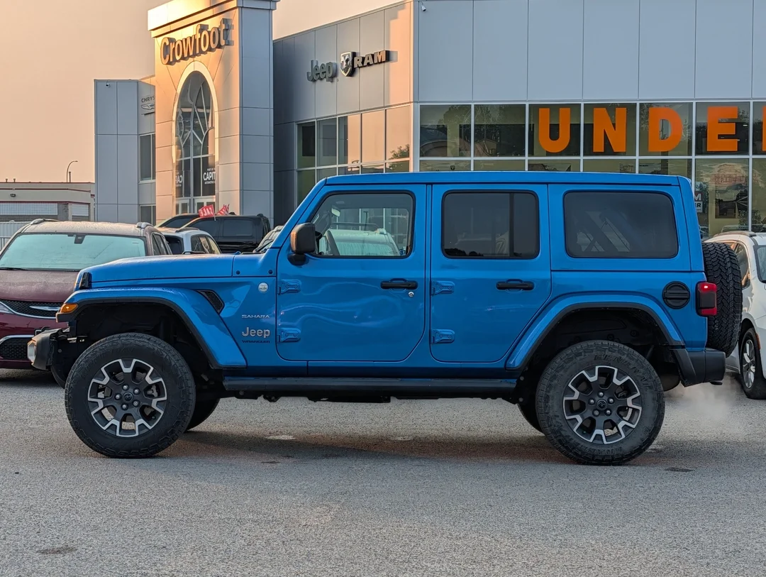 Used 2024 Blue Jeep Sahara - - 4x4 - Leather Seats - Power Soft Top - Remote Start & More! image 5