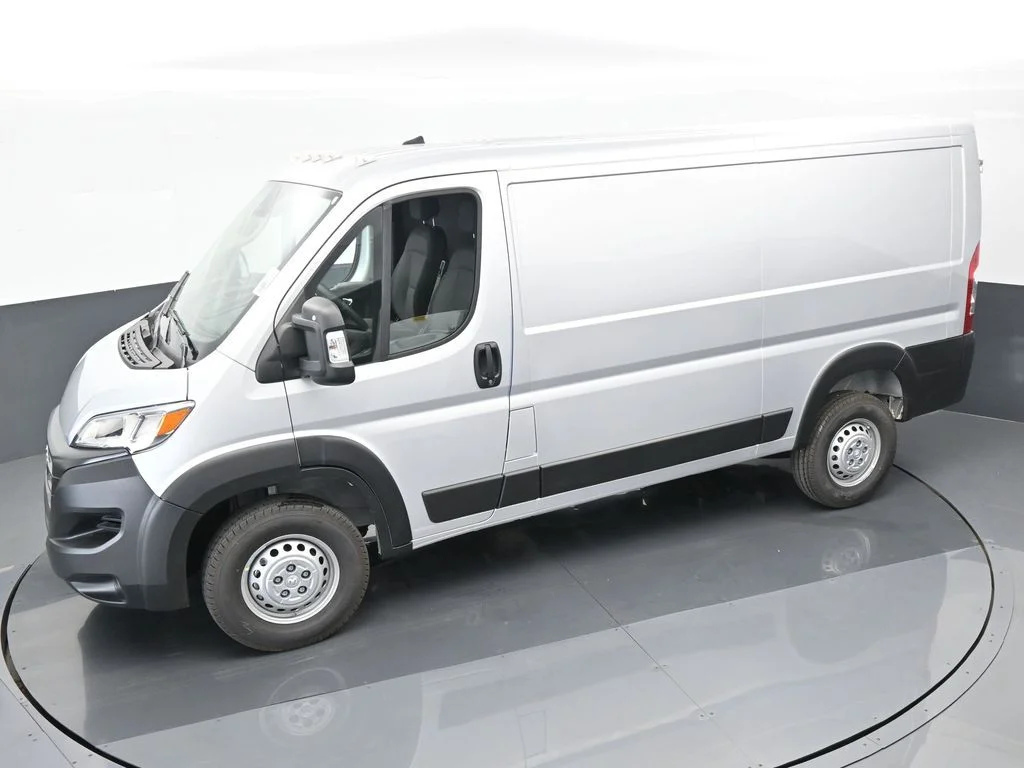 Used 2025 Bright Silver Clearcoat Metallic Ram Low Roof image 39