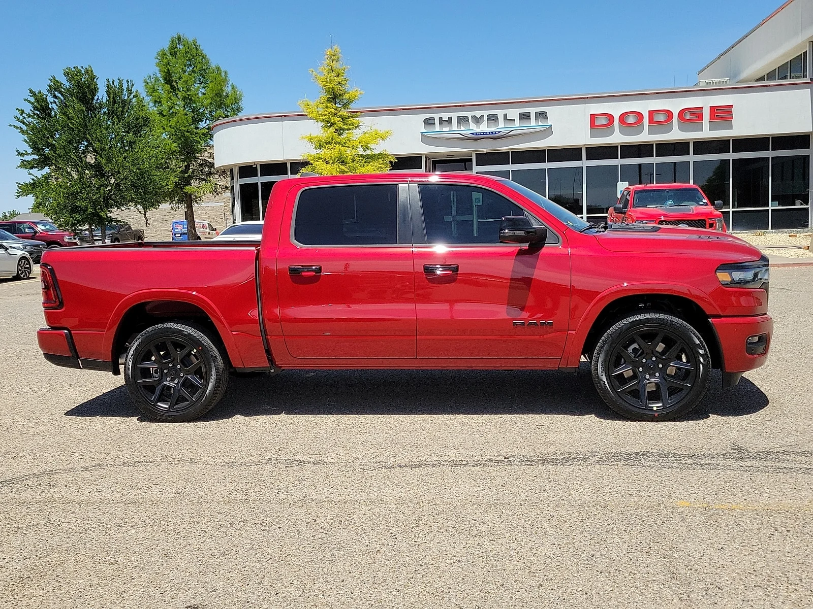 New 2026 PR6 Molten Red Ram LARAMIE CREW CAB 4X4 5
