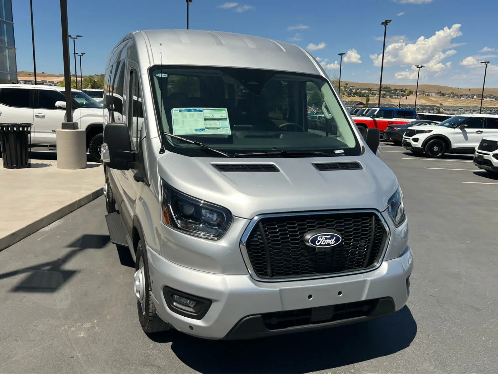 New 2026 Ingot Silver Metallic Ford Passenger Van XLT image 4