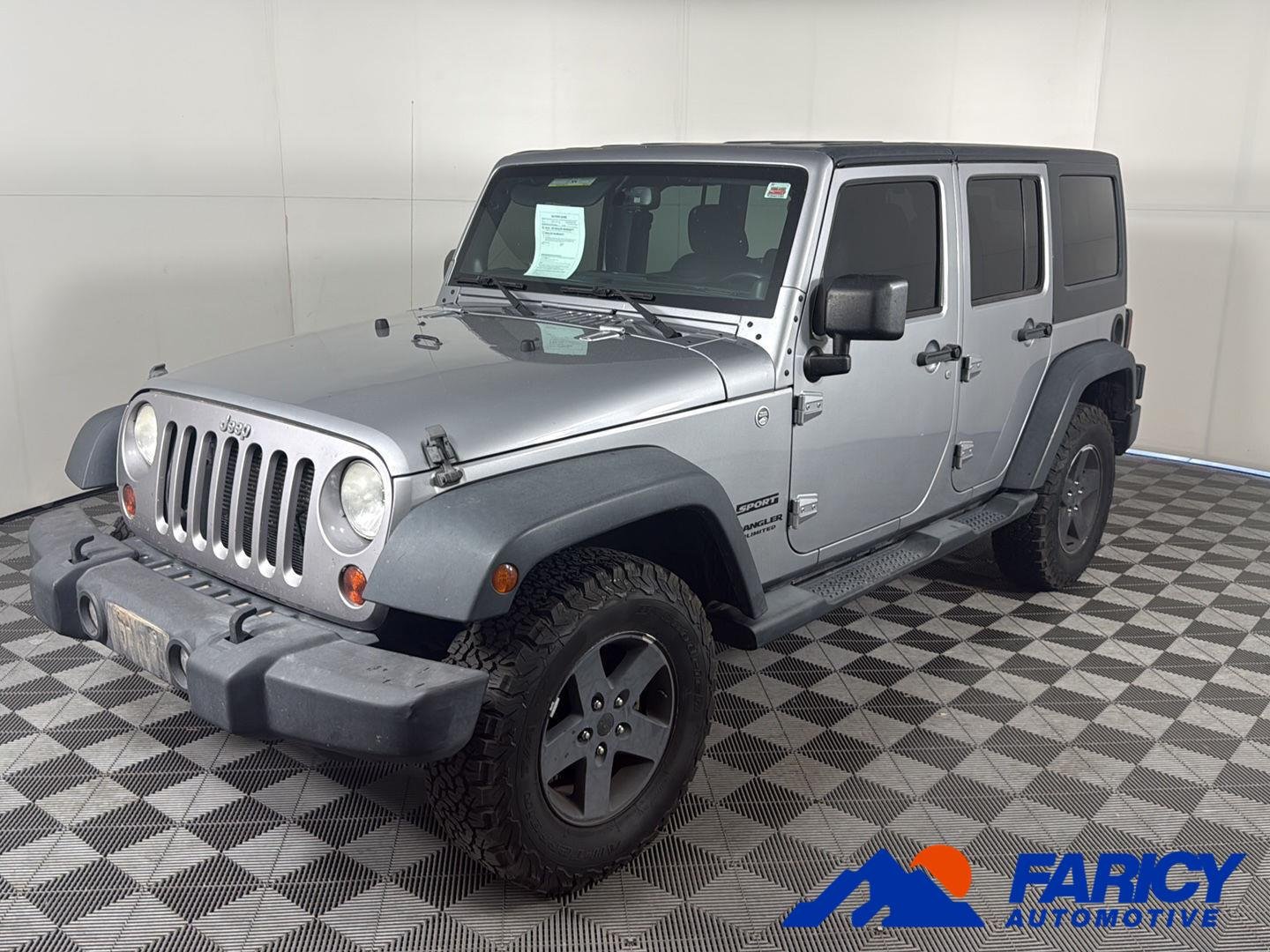 Used 2013 Billet Silver Metallic Jeep Sport image 1