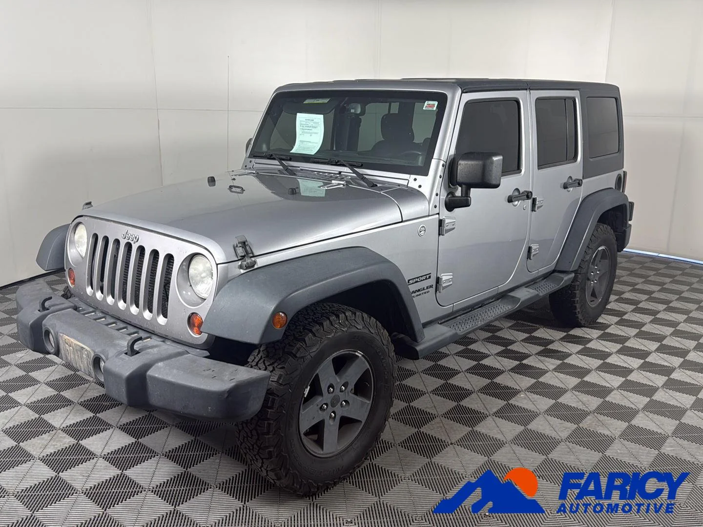 Used 2013 Billet Silver Metallic Jeep Sport image 1